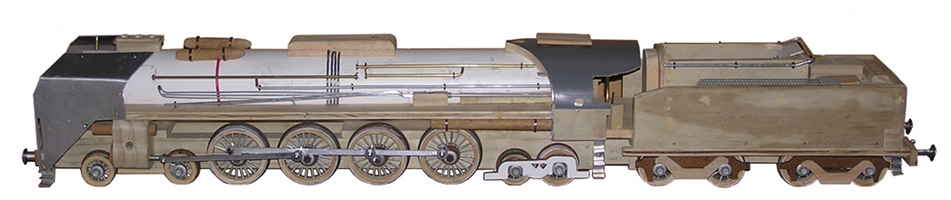 Side view of 242 A 1 steam engine model under construction,